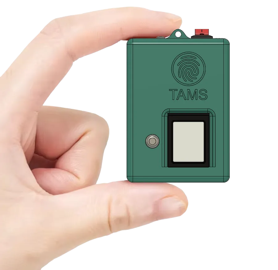 The TAMS handheld fingerprint attendance device held between two fingers